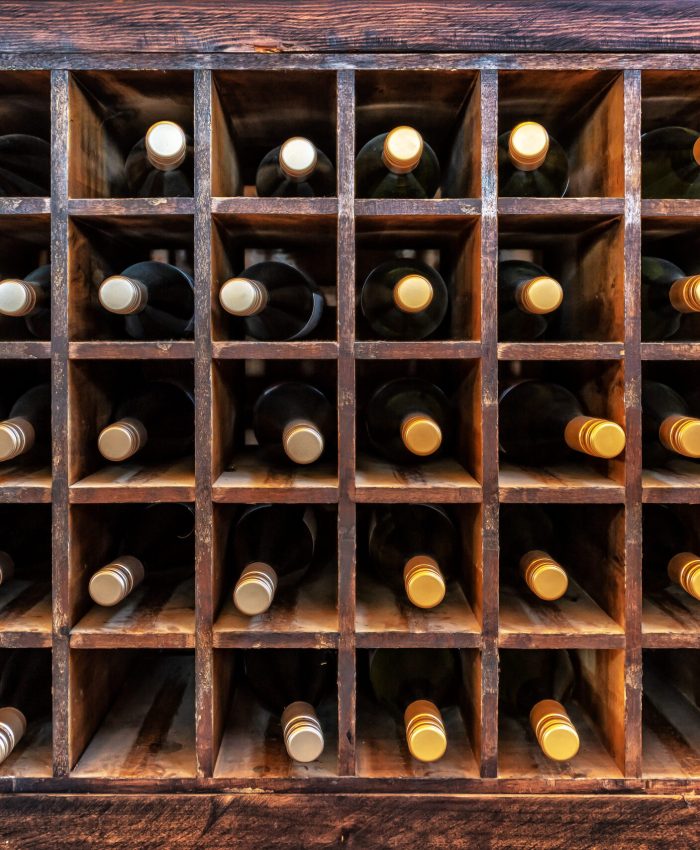 Collection of bottles of wine on wooden cases